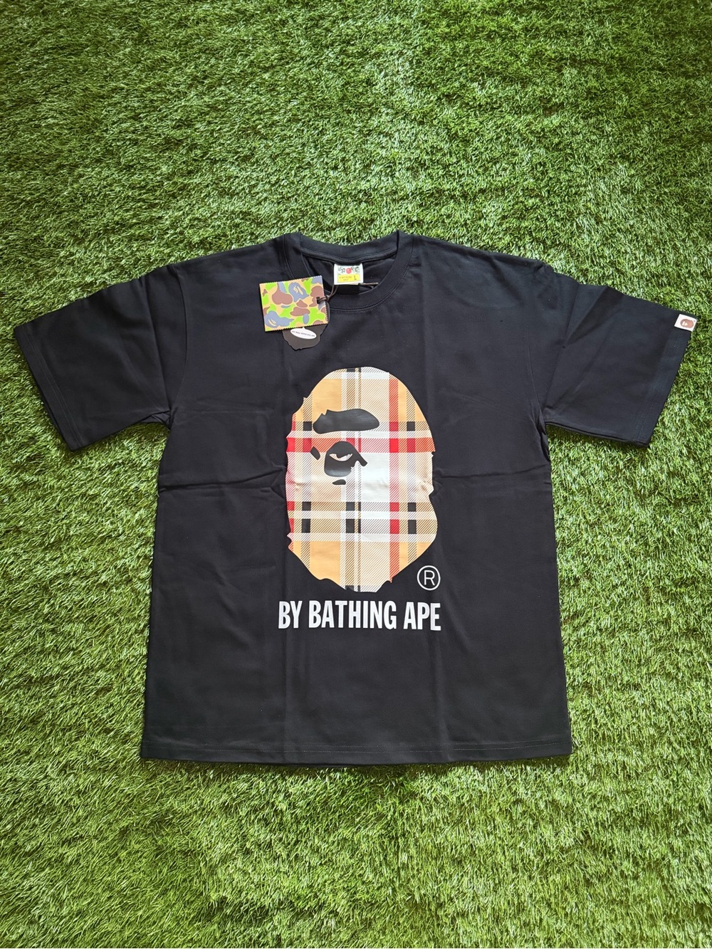 A Bathing Ape Black Tee with Plaid Ape Head